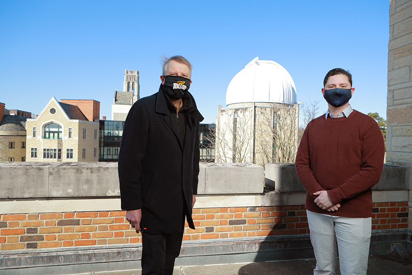 Tom Megeath, Ph.D. standing with and Ph.D. candidate Nolan Habel